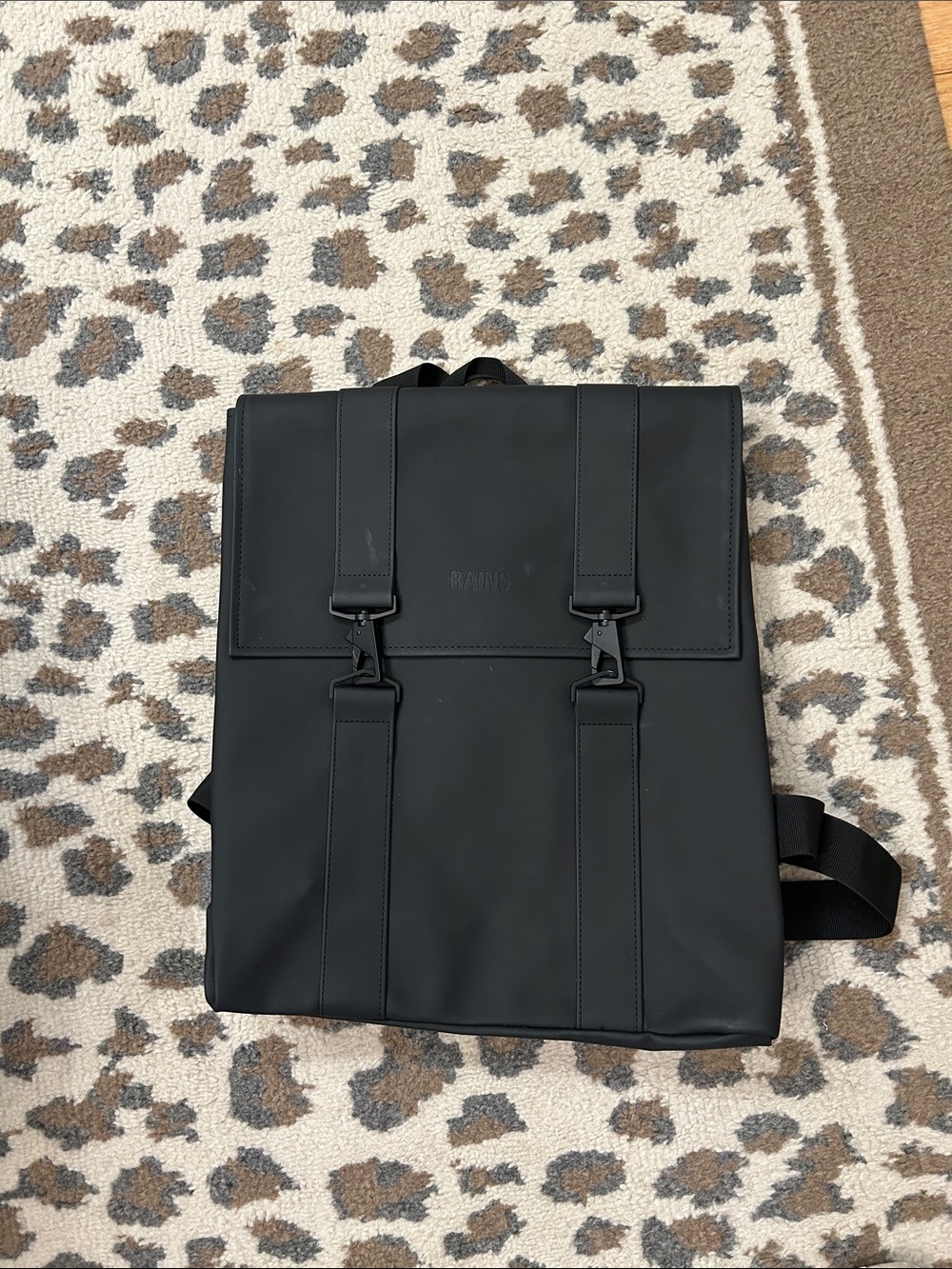 Rains Black Matte Flap Backpack with Buckle Straps